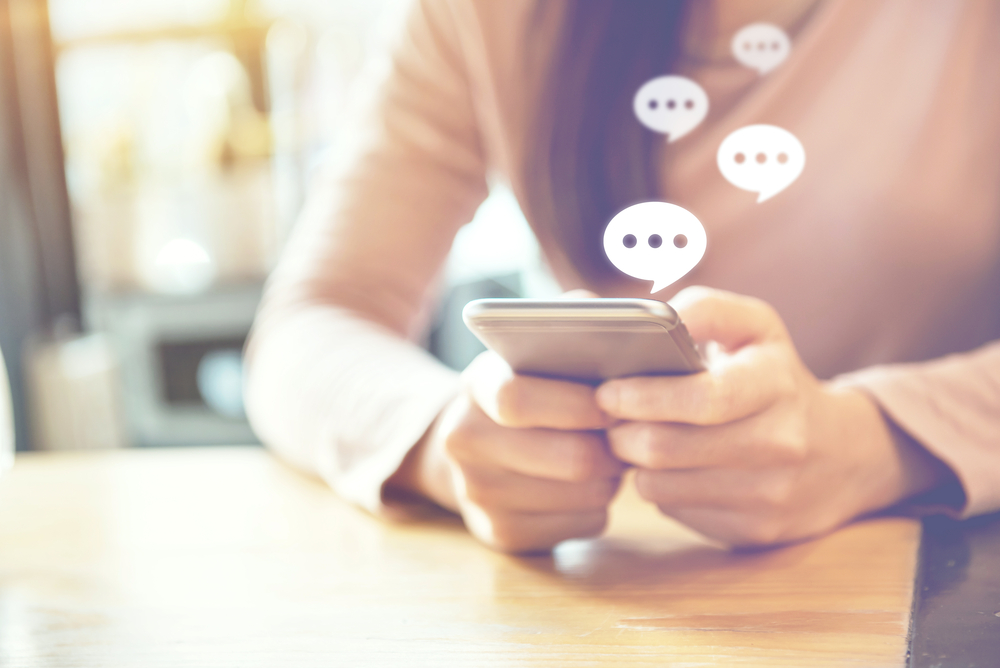 Women’s,Hand,Typing,On,Mobile,Smartphone,,Live,Chat,Chatting,On